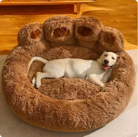 Brown plush dog bed with paw design